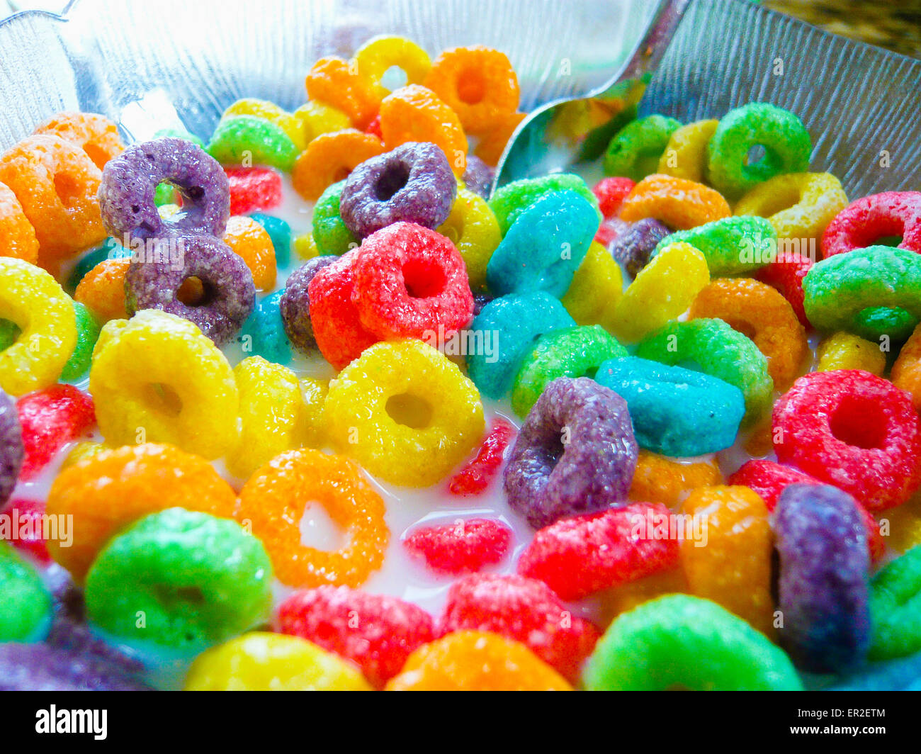 Bowl of brightly coloured Froot Loops breakfast cereal. Stock Photo