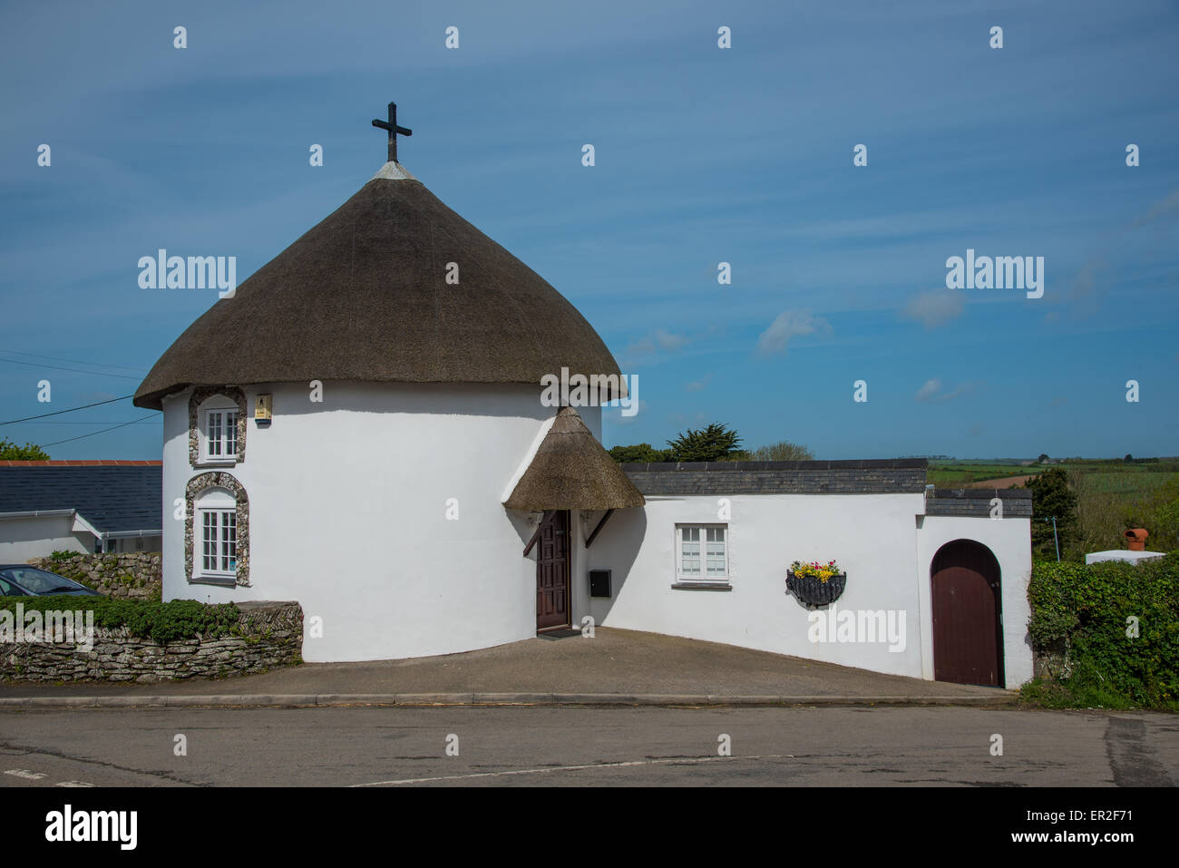 Round House at Veryan in Cornwall. The houses are said to have been built round so that the devil has no corner in which to hide Stock Photo