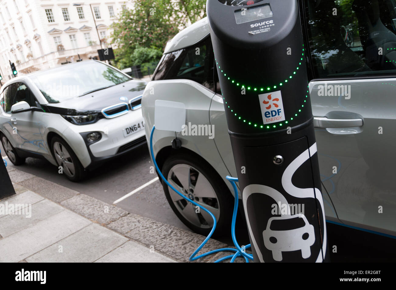 Electric BMW i3 cars plugged into electric charging bays in London ...