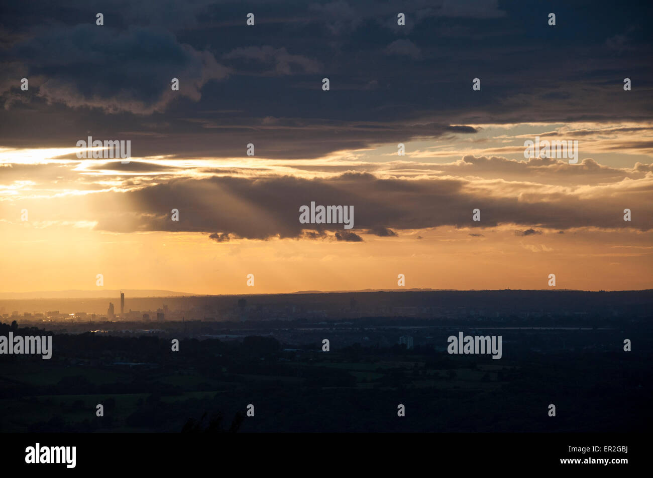 Dramatic sunset over the city of Manchester as seen from the hills of North Derbyshire. Stock Photo