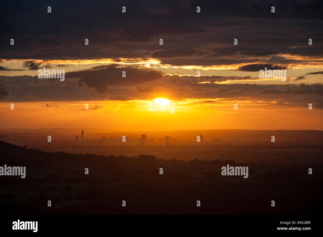Dramatic sunset over the city of Manchester as seen from the hills of North Derbyshire. Stock Photo