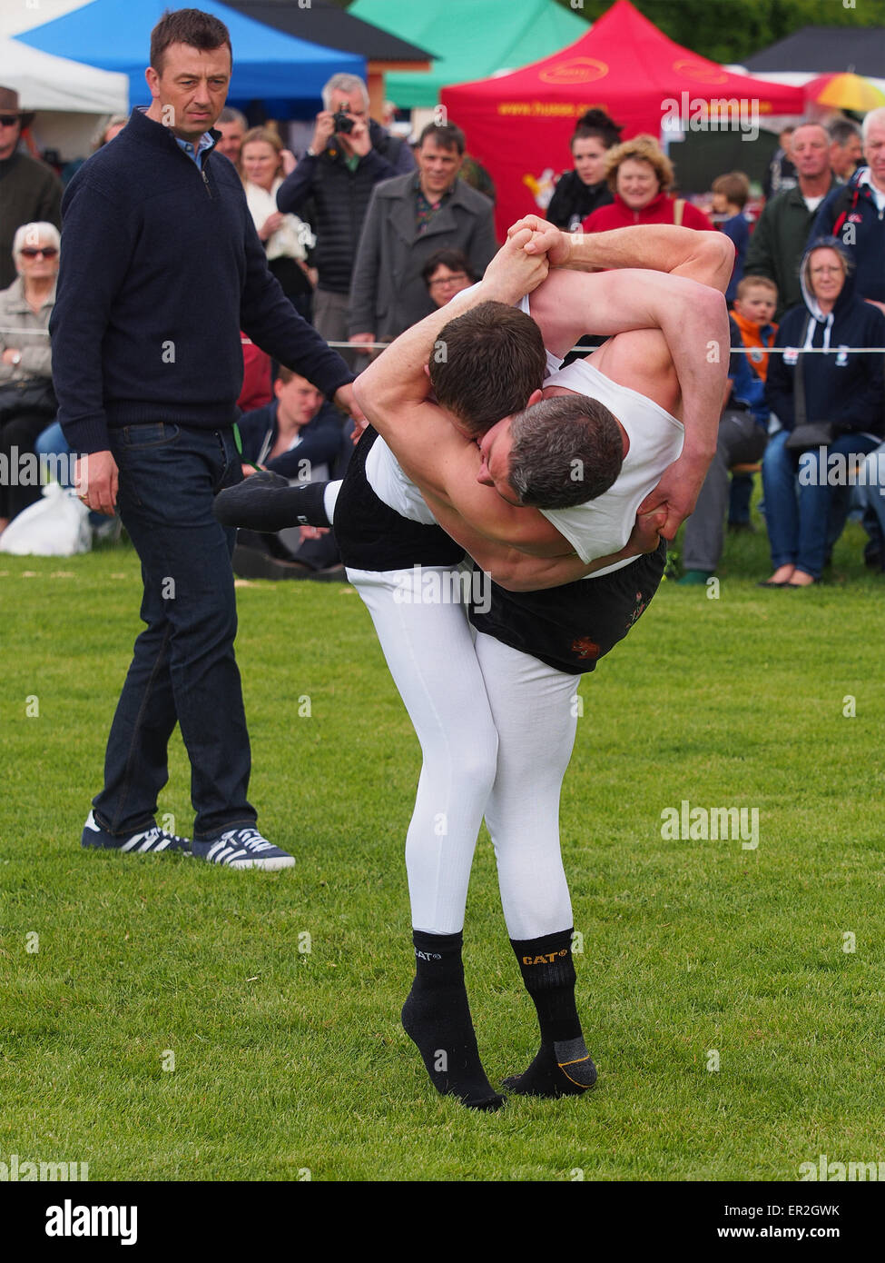 Bywell, UK. 25th May, 2015. Cumberland and Westmorland Wrestling competition at the Northumberland County Show, a traditional agricultural show with displays of livestock, produce and craft from the local area. Cumberland Wrestling is an ancient and well-practised tradition in the north country area of England. Credit:  AC Images/17�Թ����� Live News Stock Photo