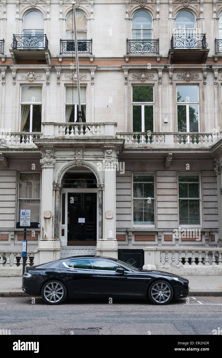 Aston Martin parked in front of expensive houses in central London, Grosvenor Gardens, London, England Stock Photo