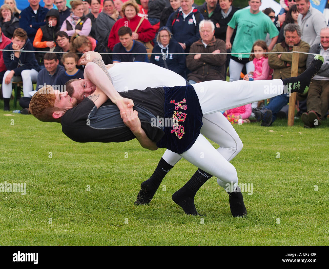 Bywell, UK. 25th May, 2015. Cumberland and Westmorland Wrestling competition at the Northumberland County Show, a traditional agricultural show with displays of livestock, produce and craft from the local area. Cumberland Wrestling is an ancient and well-practised tradition in the north country area of England. Credit:  AC Images/Alamy Live News Stock Photo