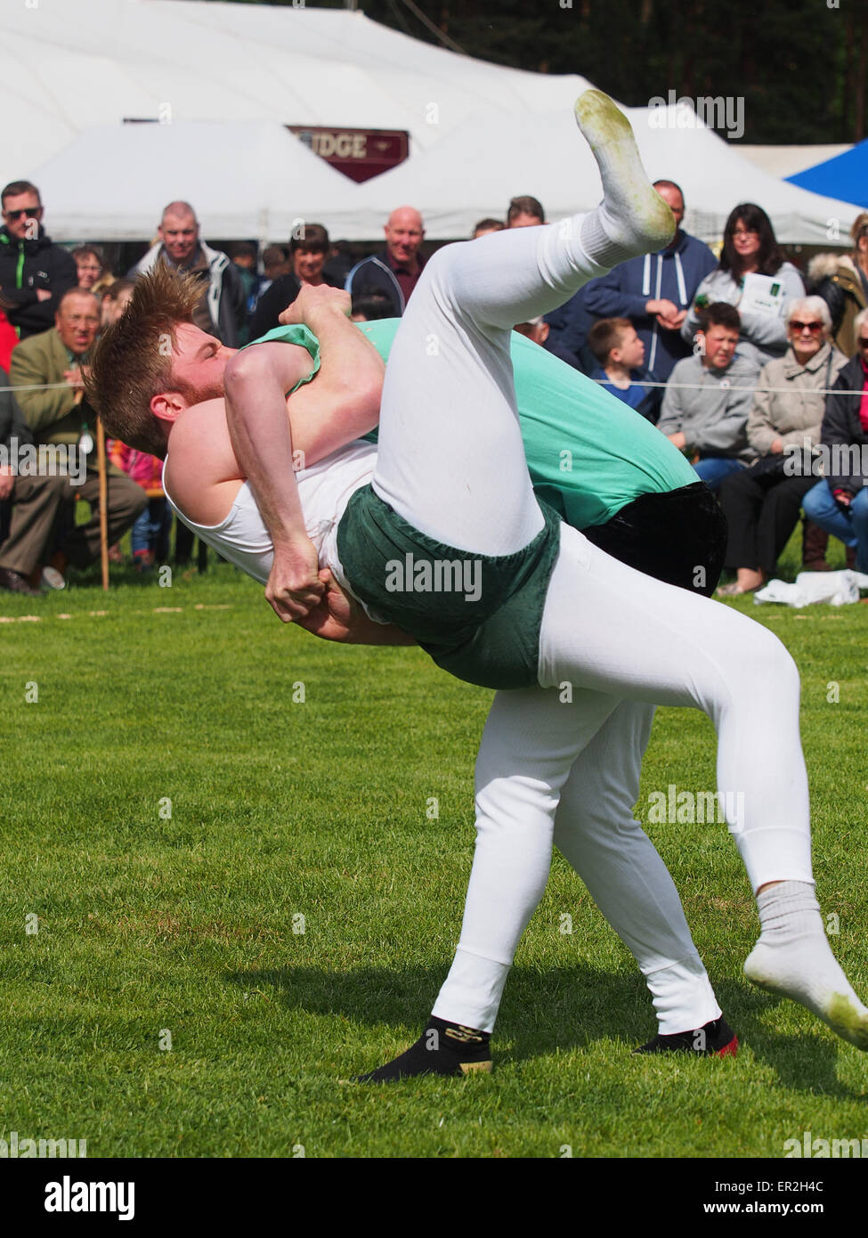 Bywell, UK. 25th May, 2015. Cumberland and Westmorland Wrestling competition at the Northumberland County Show, a traditional agricultural show with displays of livestock, produce and craft from the local area. Cumberland Wrestling is an ancient and well-practised tradition in the north country area of England. Credit:  AC Images/17�Թ����� Live News Stock Photo