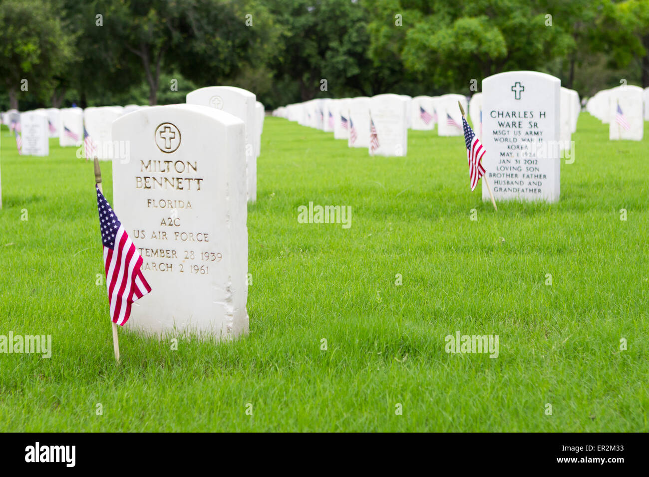 Small American flags decorate graves for Memorial Day ceremonies at