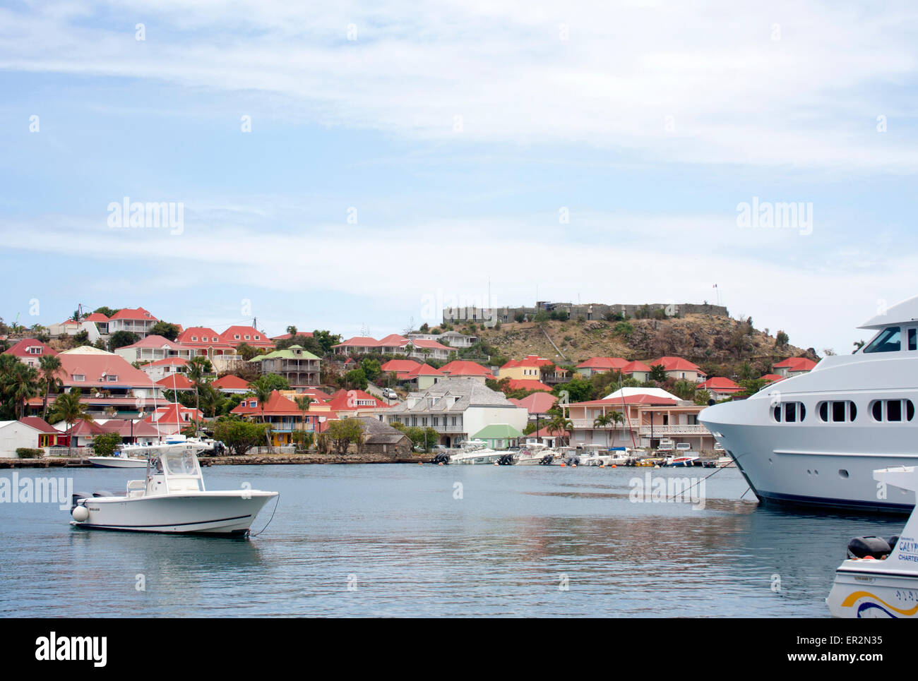 Boats and yachts anchored in the harbor of Gustavia, St. Barts Stock Photo