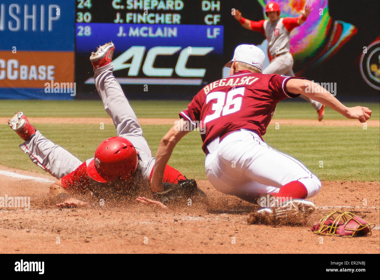 outfielder Bubby Riley (2) of the NC State Wolfpack dives for home ...