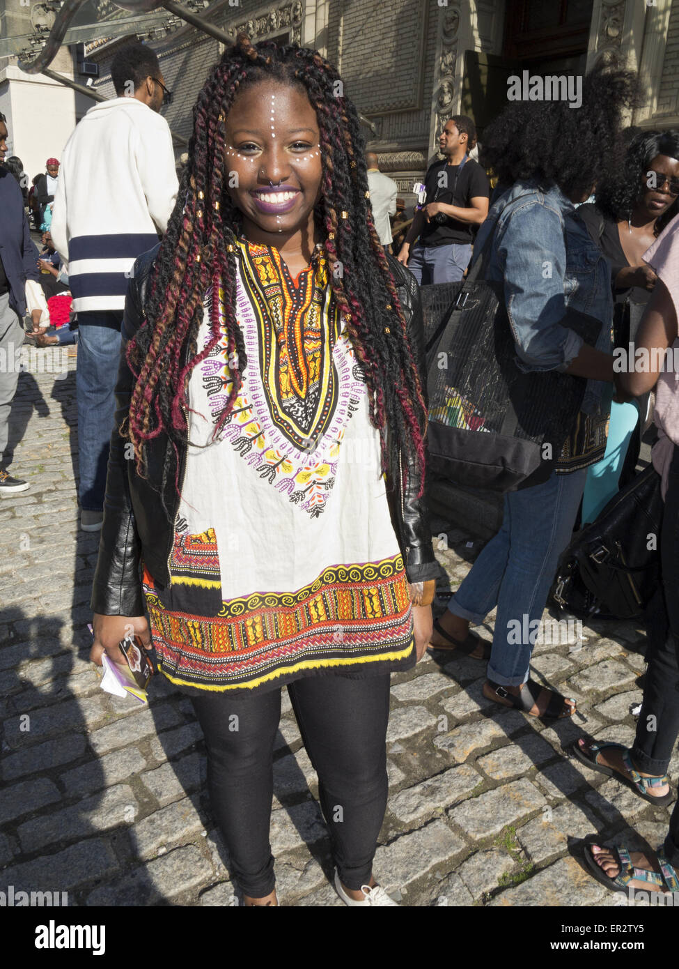 Young woman wearing African inspired clothing, hair and makeup at The