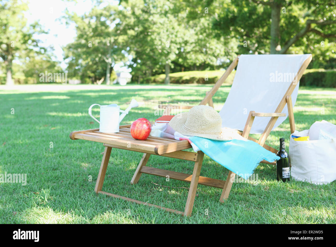 Deck chair in a city park Stock Photo - Alamy