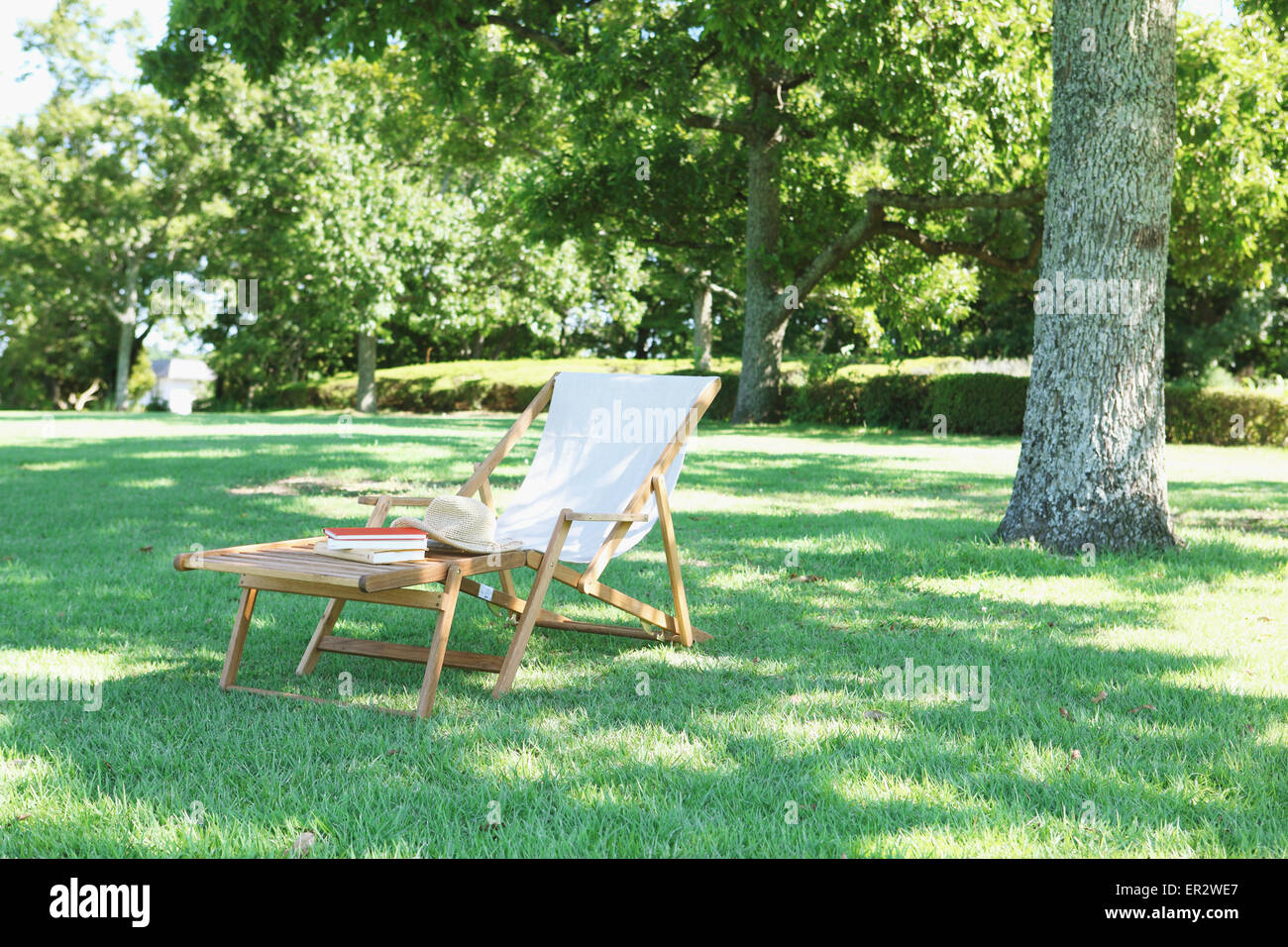 Deck chair in a city park Stock Photo - Alamy