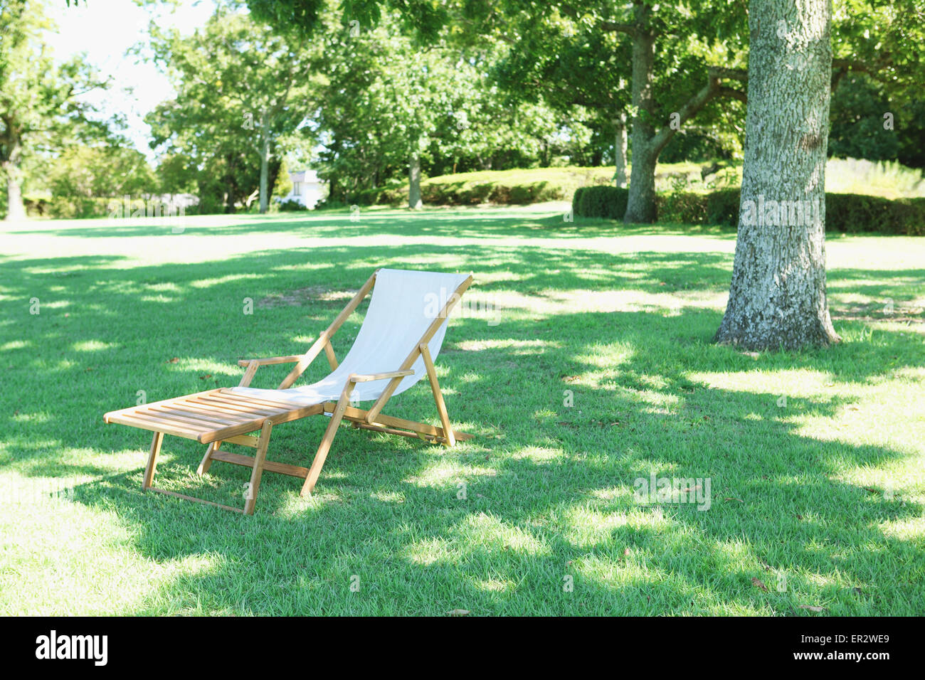 Deck chair in a city park Stock Photo - Alamy
