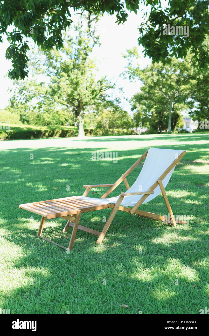 Deck chair in a city park Stock Photo - Alamy