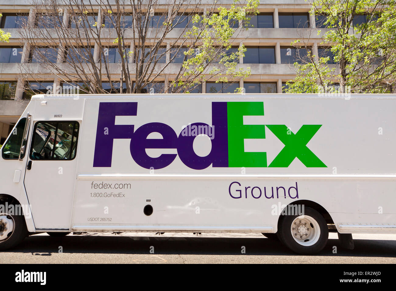 FedEx truck parked in front of office buildings - Washington, DC USA Stock Photo
