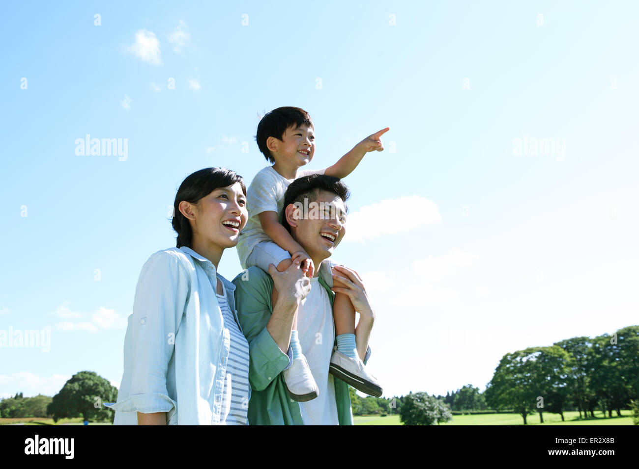 Happy Japanese family in a city park Stock Photo Alamy