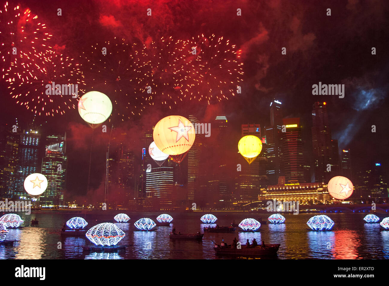The Singapore skyline is illuminated by fireworks for New year celebrations in the Marina Bay Central Business District (CBD) Stock Photo