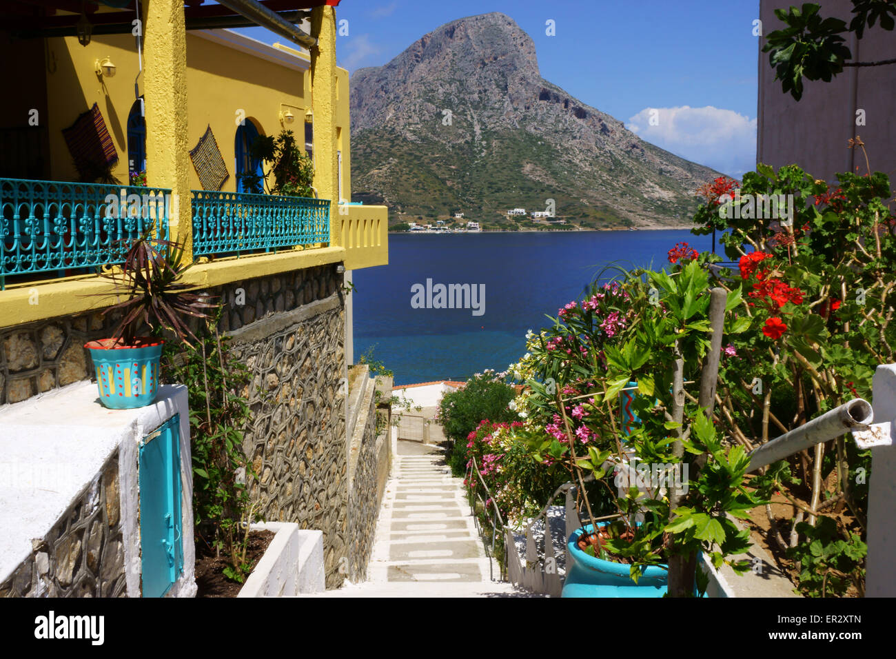 Town Massouri on Island Kalymnos in back Island Telendos, Greece Stock Photo