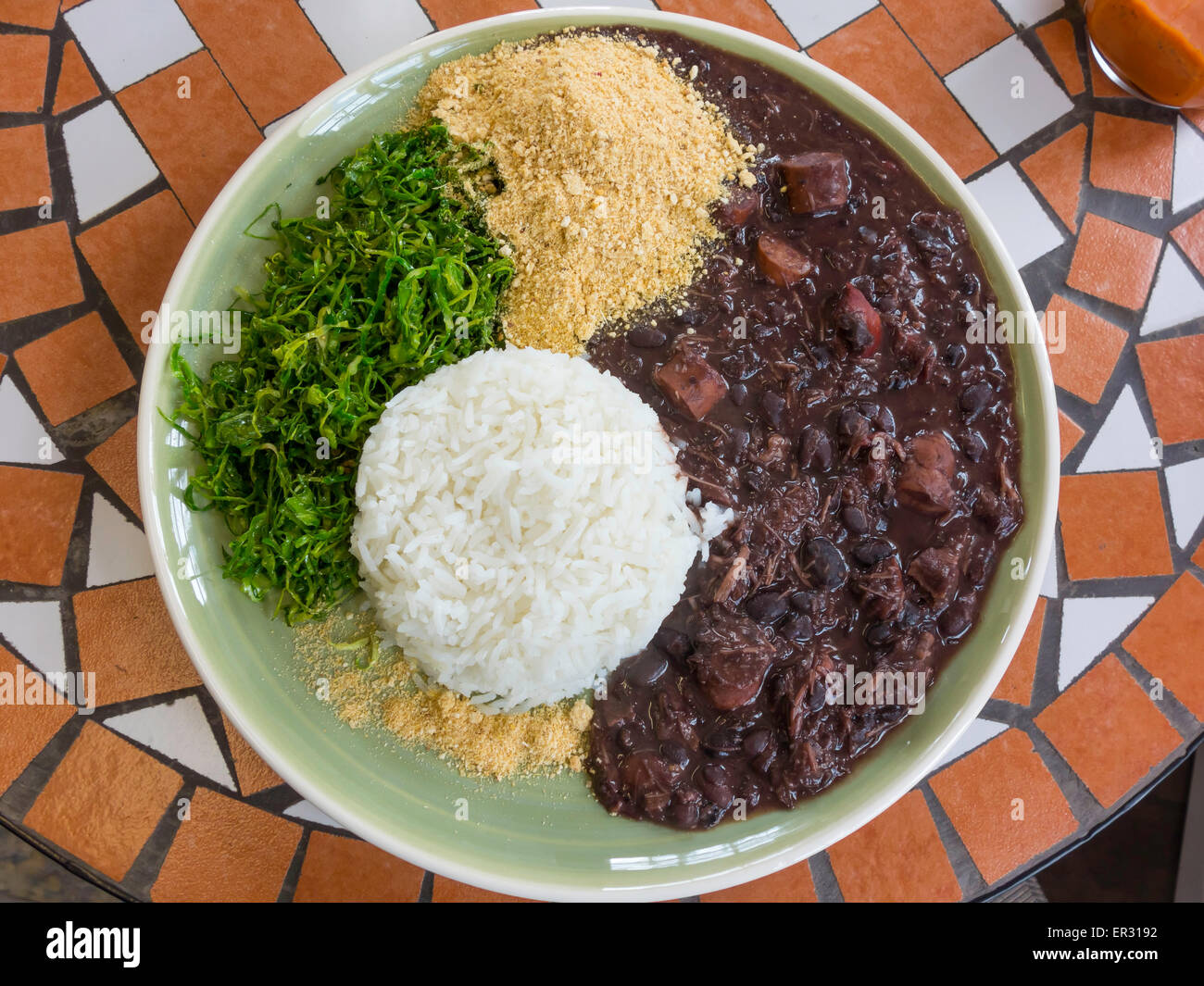 Café lunch a dish of Feijoada beef and black bean stew with Cassava