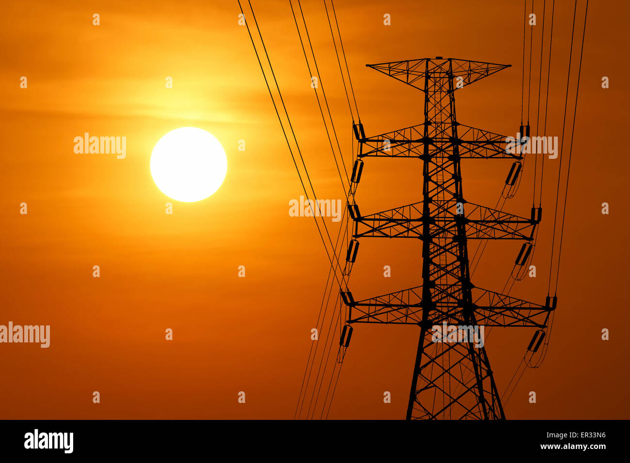 silhouette of high voltage electric tower with beautiful sunset ...