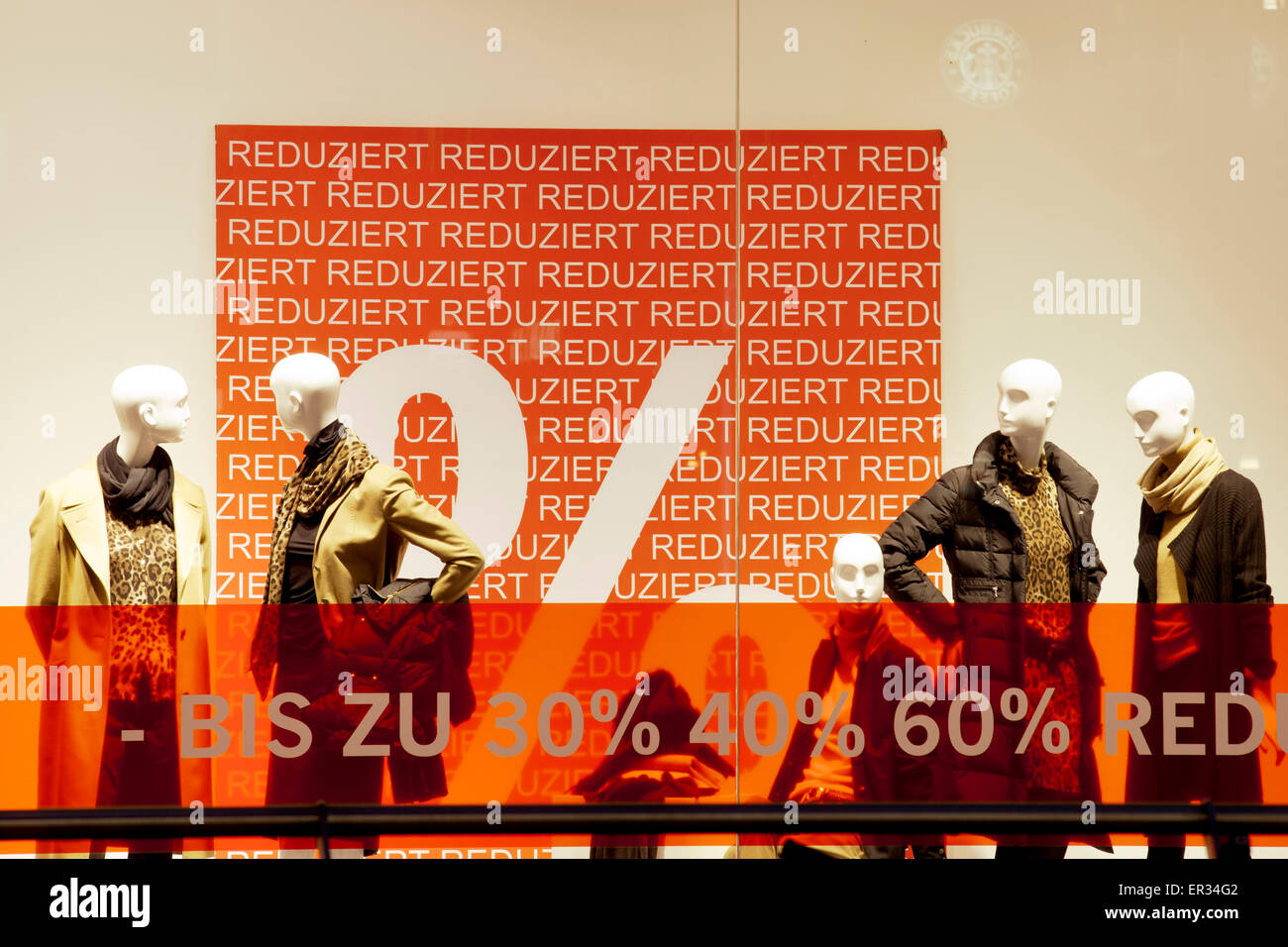 Europe, Germany, North Rhine-Westphalia, Cologne, shop windows with winter sale placards at the shopping street Schildergasse.   Stock Photo