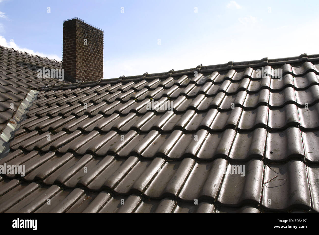 DEU, Germany, North Rhine-Westphalia, Hamminkeln-Marienthal, roof, pan tiles, chimney.  DEU, Deutschland, Nordrhein-Westfalen, H Stock Photo