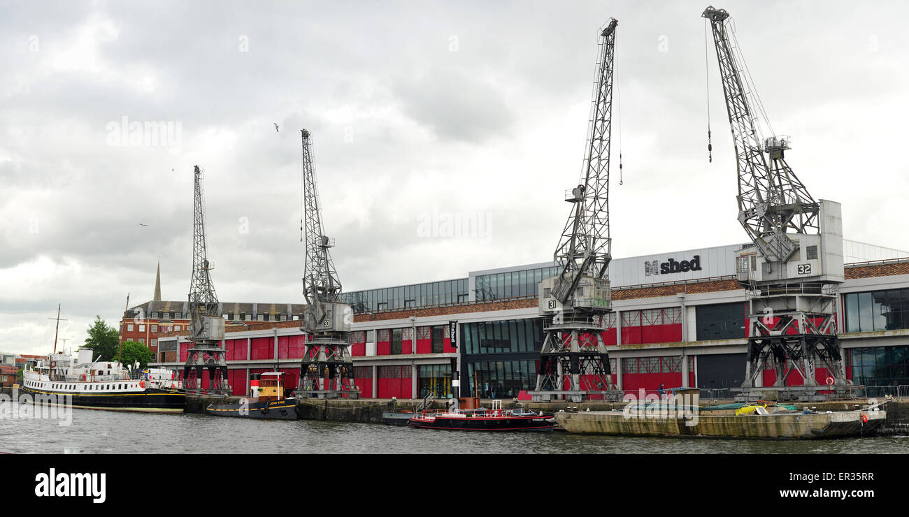 Four preserved electrically powered cargo cranes outside the M Shed