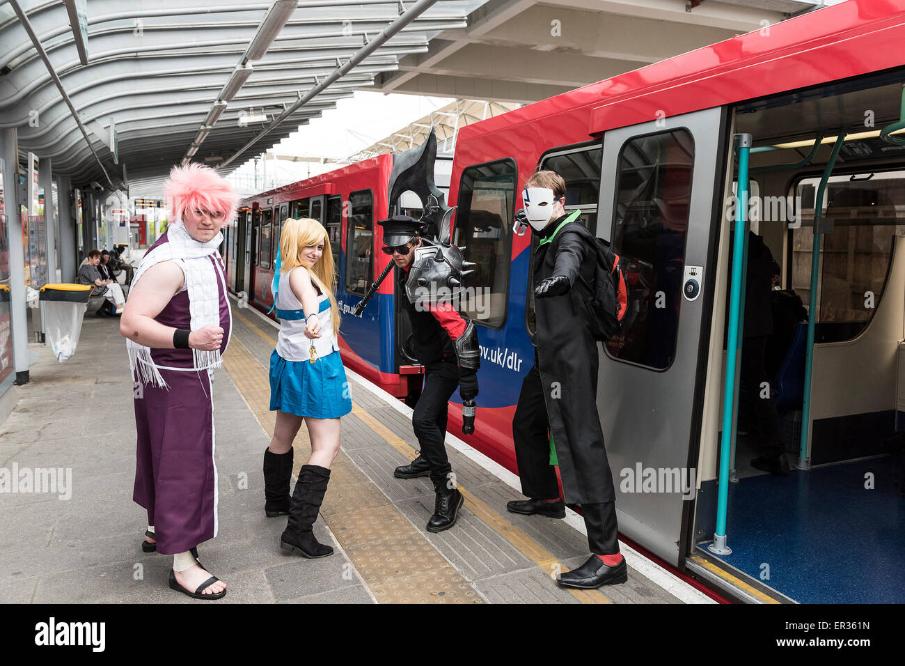 Cosplay enthusiasts travelling on the DLR to the MCM London Comic Con at the Excel centre. Stock Photo