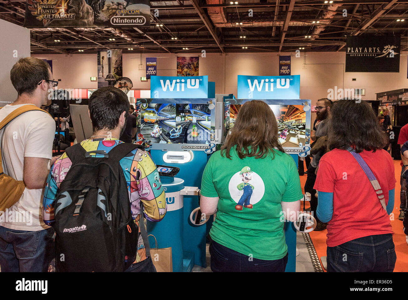 Gaming enthusiasts playing the latest Wii games at the MCM London Comic Con at the Excel Centre. Stock Photo