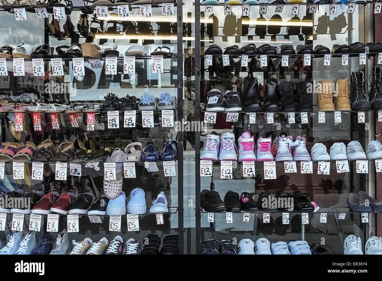 Racks of shoes for sale. Stock Photo