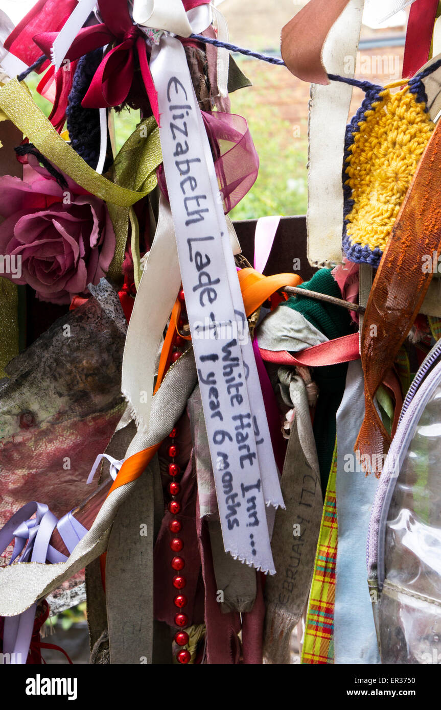 Ribbons tied to the gates of Crossbones graveyard commemorate those thought to be buried there.  Here a child of the 1840s. Stock Photo