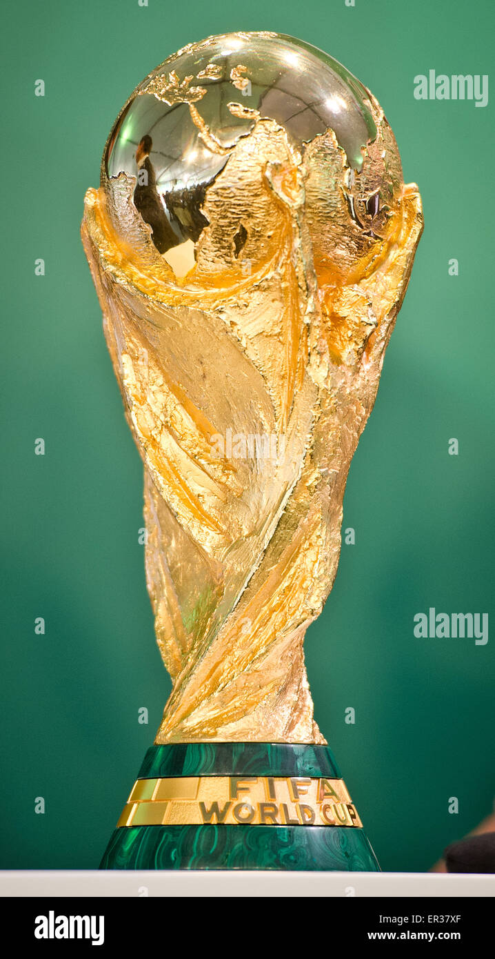 Frankfurt, Germany. 26th May, 2015. An official FIFA copy of the World Cup trophy can be seen on a table during a press event at the Hahnstrasse local sports facility in the district of Niederrad in Frankfurt am Main, Germany, 26 May 2015. For three months the trophy will go on a victory lap - 63 amateur clubs were selected from 800 applicants to host the trophy for a day. Photo: CHRISTOPH SCHMIDT/dpa Credit:  dpa picture alliance/Alamy Live News Stock Photo