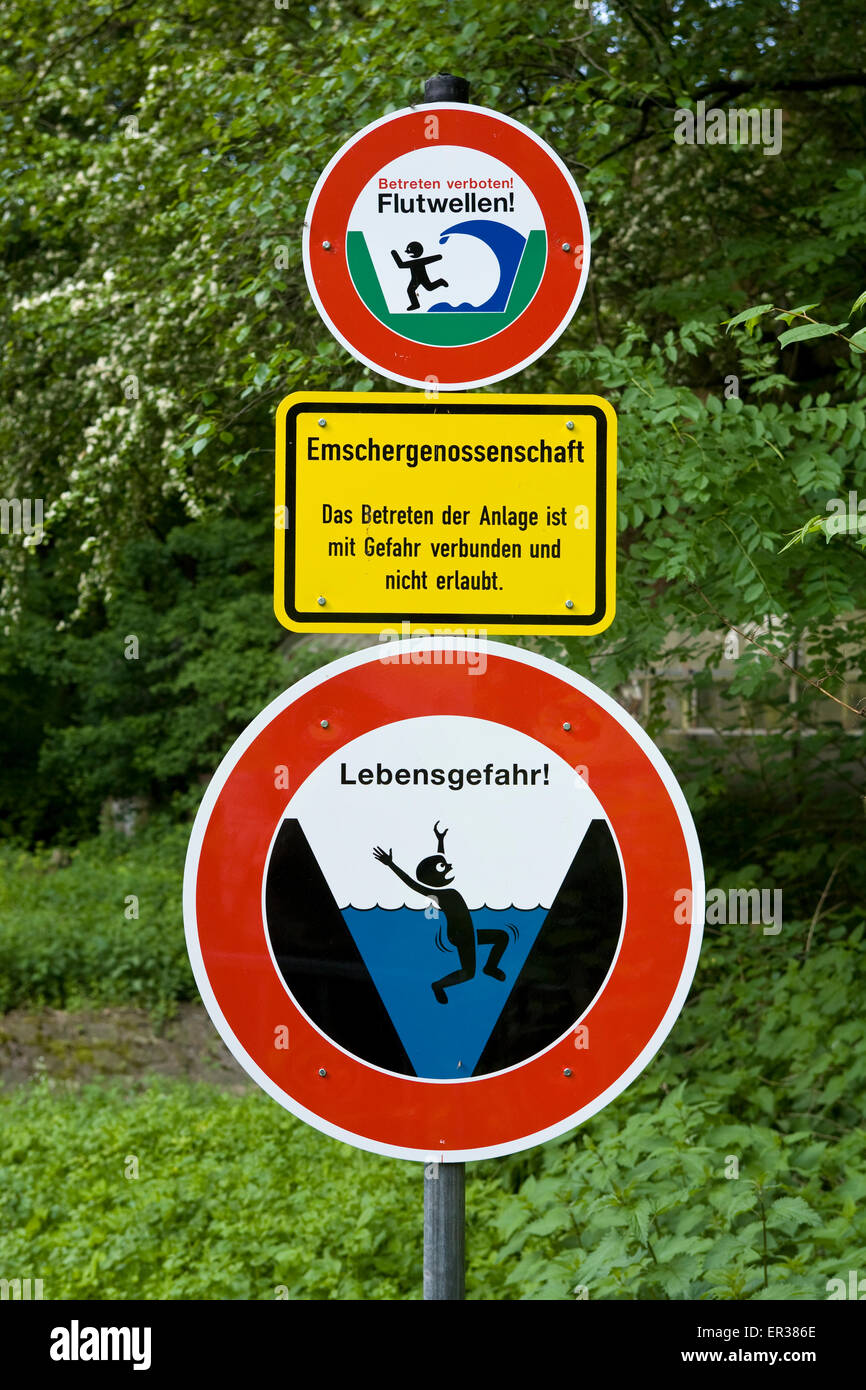Europe, Germany, North Rhine-Westphalia, Ruhr area, Dortmund, warning signs at the river Emscher in the town district Bruenningh Stock Photo
