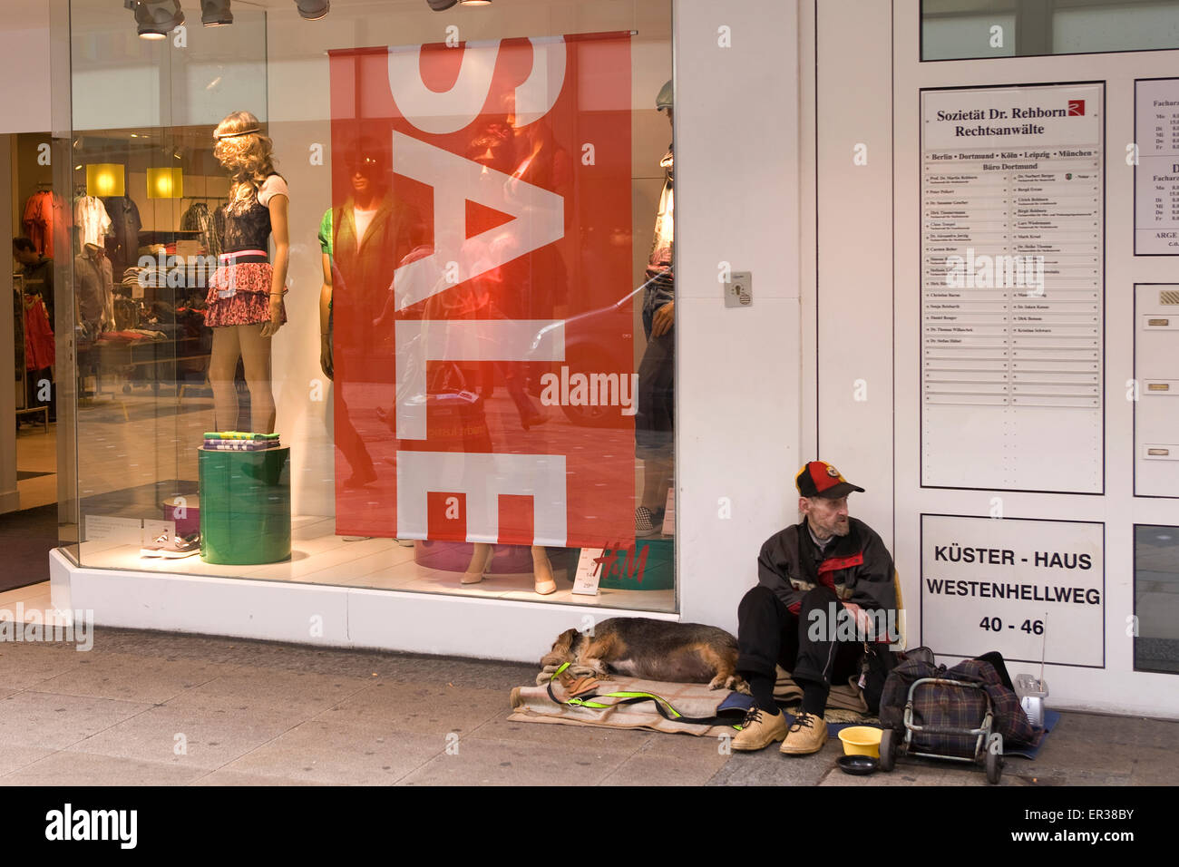 Europe, Germany, North Rhine-Westphalia, Dortmund, shop windows with summer sale placards at the Westenhellweg, beggar.  Europa, Stock Photo
