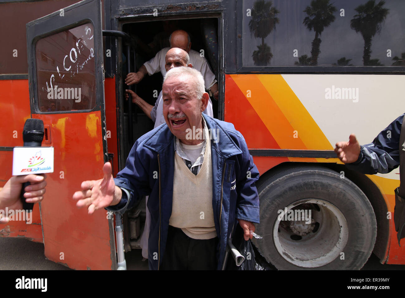 Gaza. 26th May, 2015. A Palestinian man cries out of joy after returning to Gaza through Rafah crossing point between Egypt and the southern Gaza Strip, May 26, 2015. The Egyptian authorities on Tuesday reopened the crossing with Gaza for the first time in nearly 80 days. Egypt decided to reopen Rafah crossing for two days in one-way direction, Palestinian Officials said. Credit:  Khaled Omar/Xinhua/Alamy Live News Stock Photo