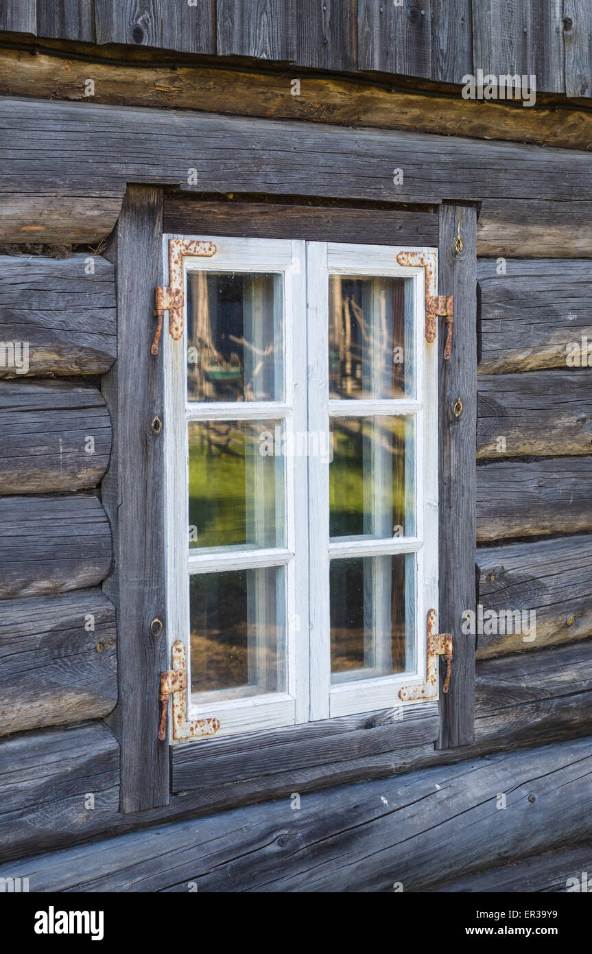 Rustic cottage window in old wooden rural house Stock Photo