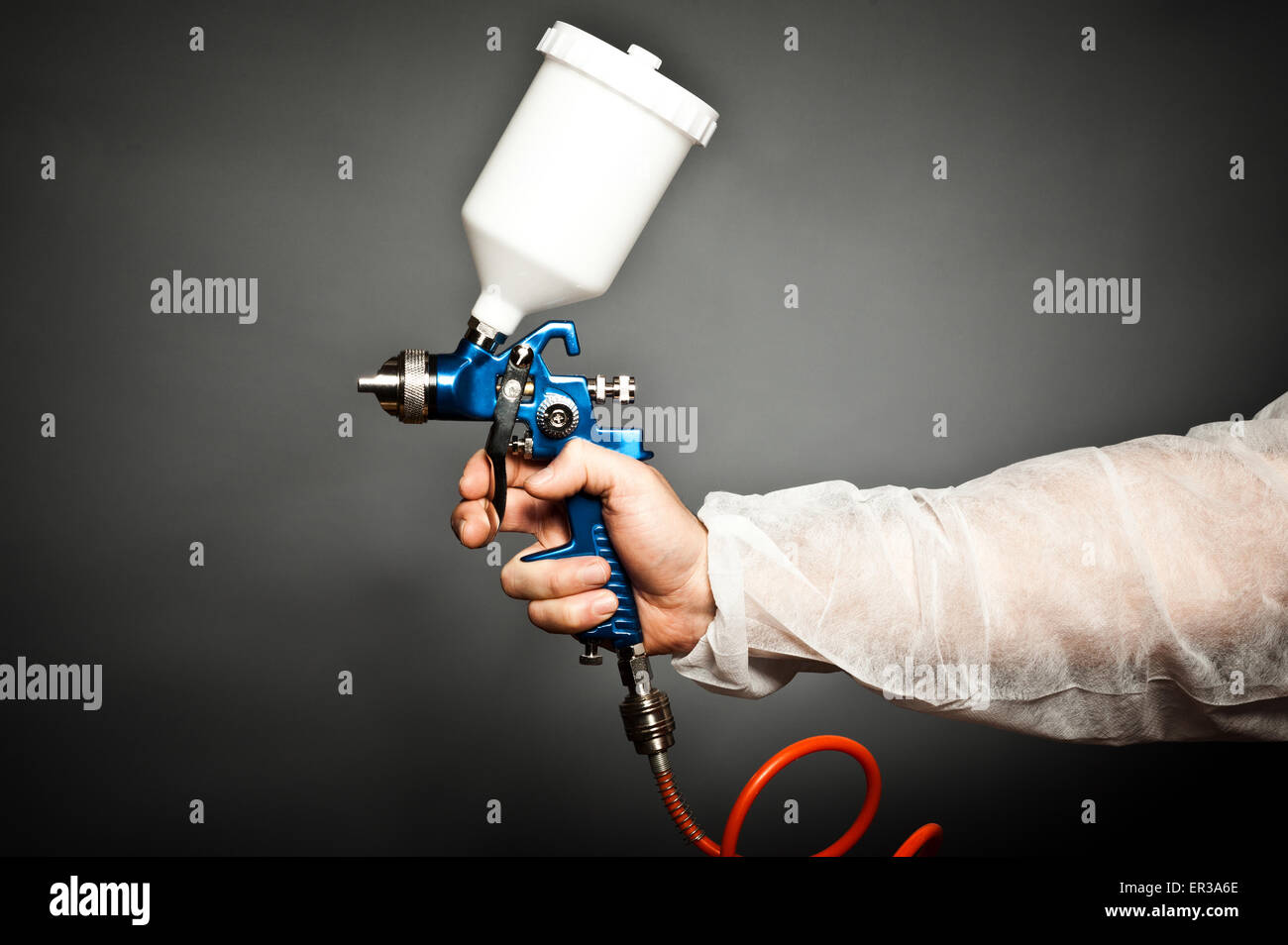 closeup image of hand hold spray gun Stock Photo