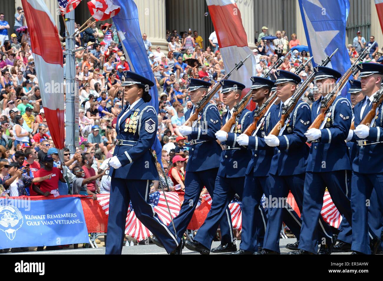 The U.S. Air Force Honor Guard marches during the National Memorial Day Parade in Washington, D.C., May 25, 2015.  The National Memorial Day Parade was first launched in 2005 by the American Veterans Center in Washington, and this year Air Force Chief of Staff Gen. Mark A. Welsh III served as the grand marshal. Welsh also honored American Veterans by attending a wreath laying ceremony in Arlington National Cemetery. Stock Photo