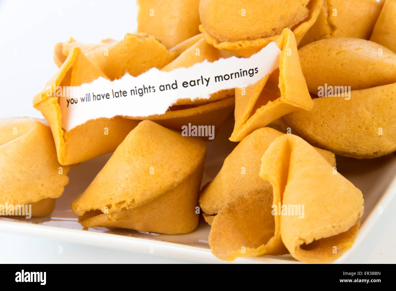 open fortune cookie with strip of white paper - YOU WILL HAVE LATE ...