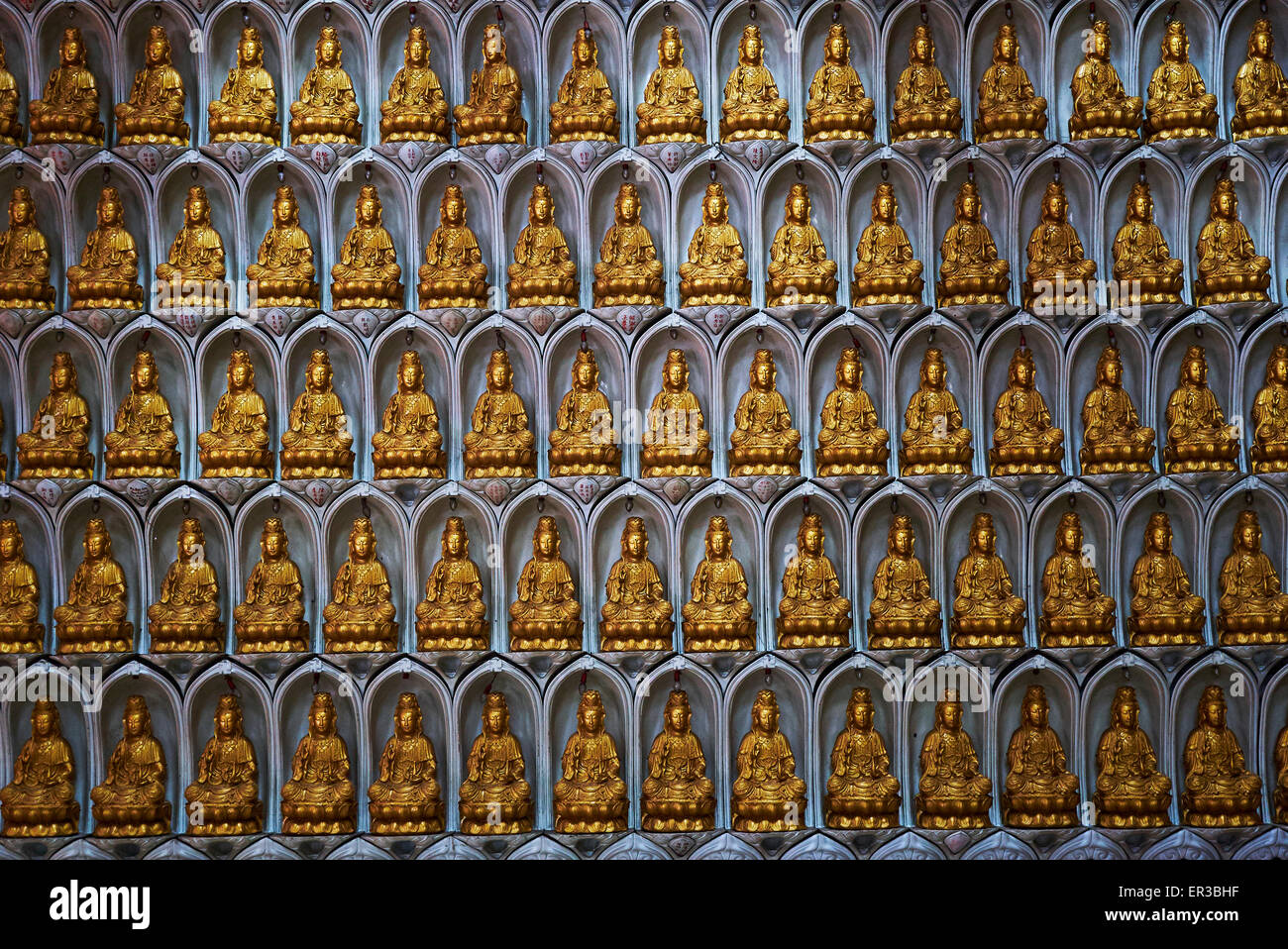 Wall of Buddha statues in a temple, Malaysia Stock Photo Alamy