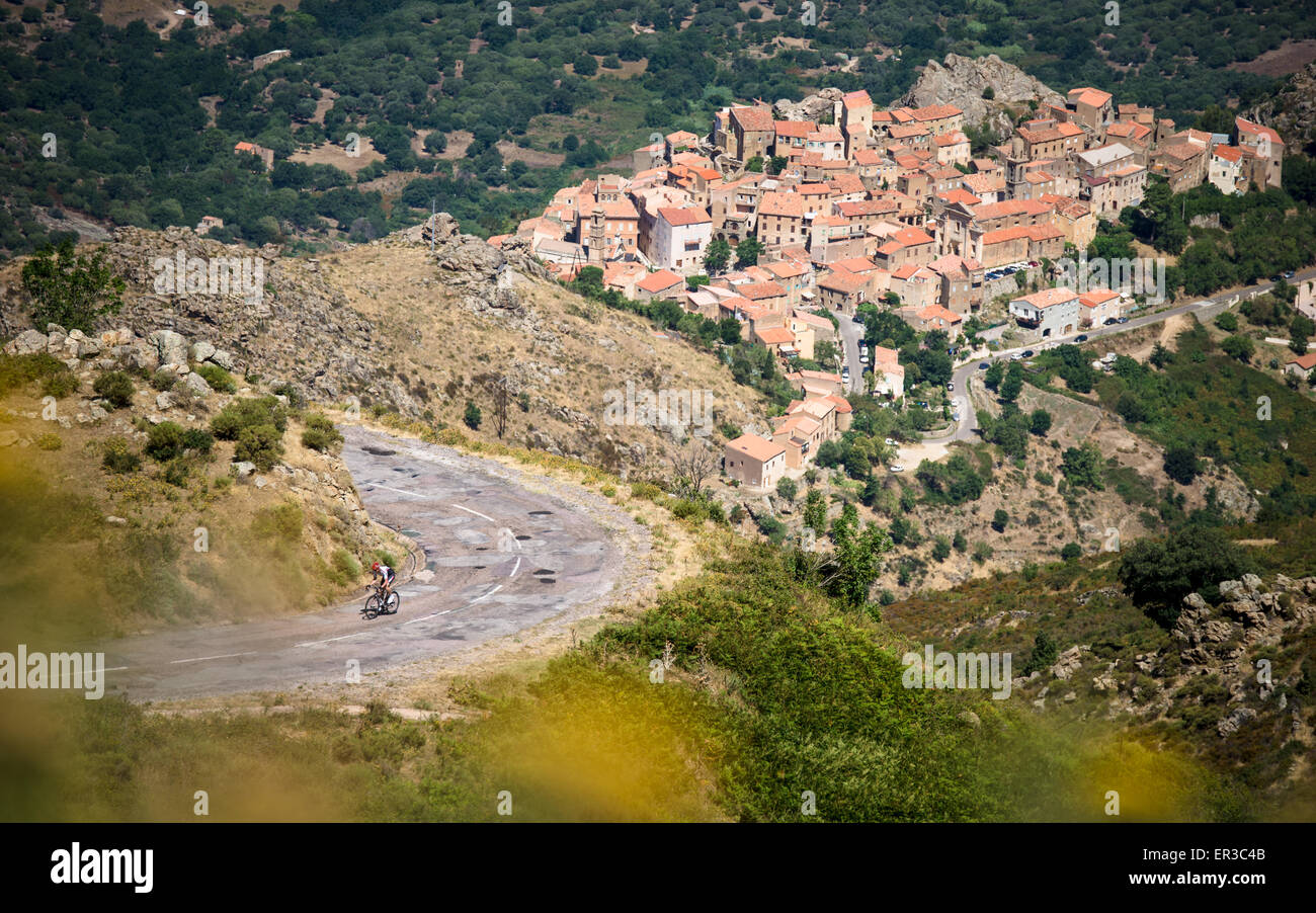 Man cycling on a mountain road near Lumio, Corsica, France Stock Photo