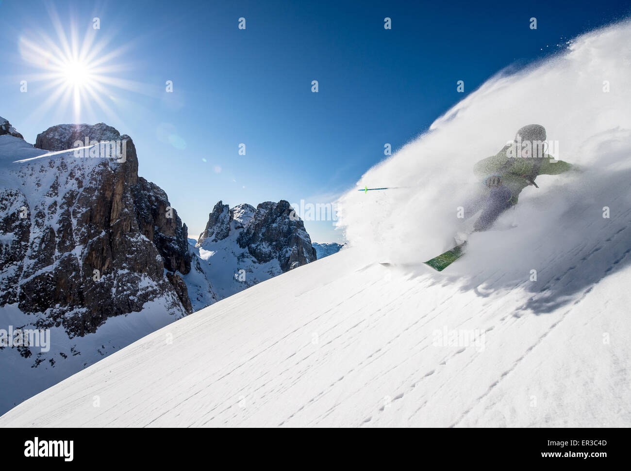 Man skiing off piste, Dolomites, Italy Stock Photo