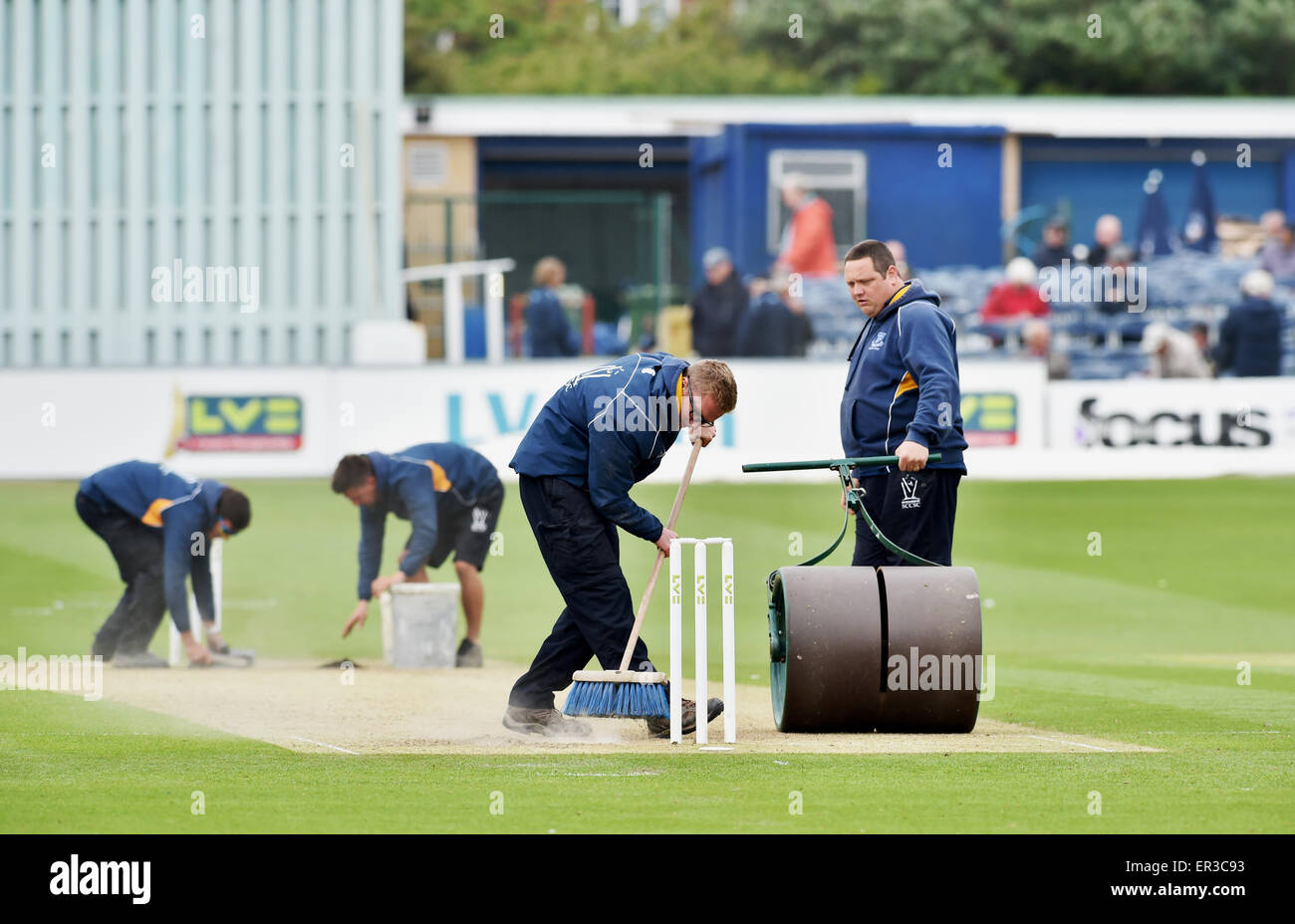 Brighton UK 24th May 2015 - Ground staff at Sussex Cricket Club preparing the wicket and pitch for play during the game between Sussex and Warwickshire  The pitch has come under suspicion by the ECB after the large number of wickets that were taken on the first day Stock Photo