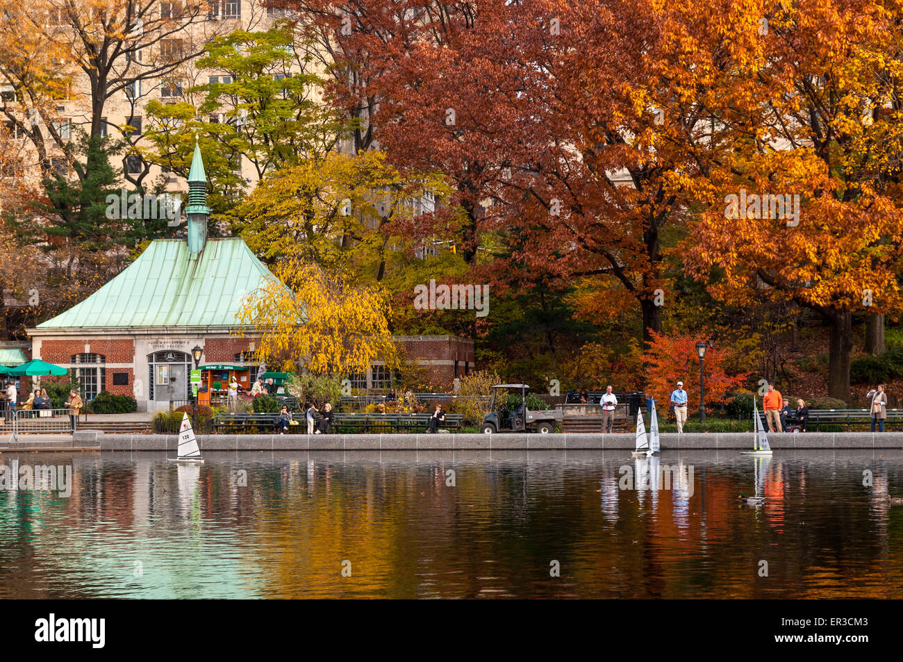 A people sailing a model boats at the Conservatory Water in New York's Central Park Stock Photo