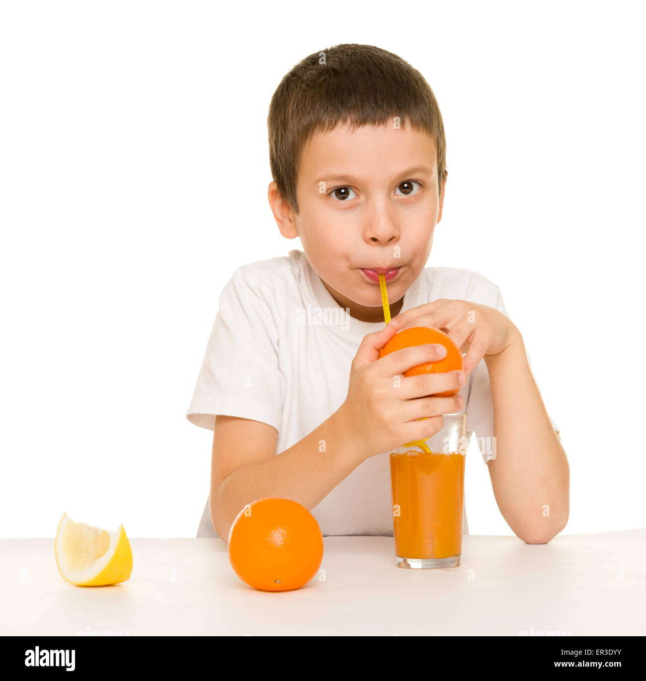 boy drink orange juice with a straw Stock Photo Alamy
