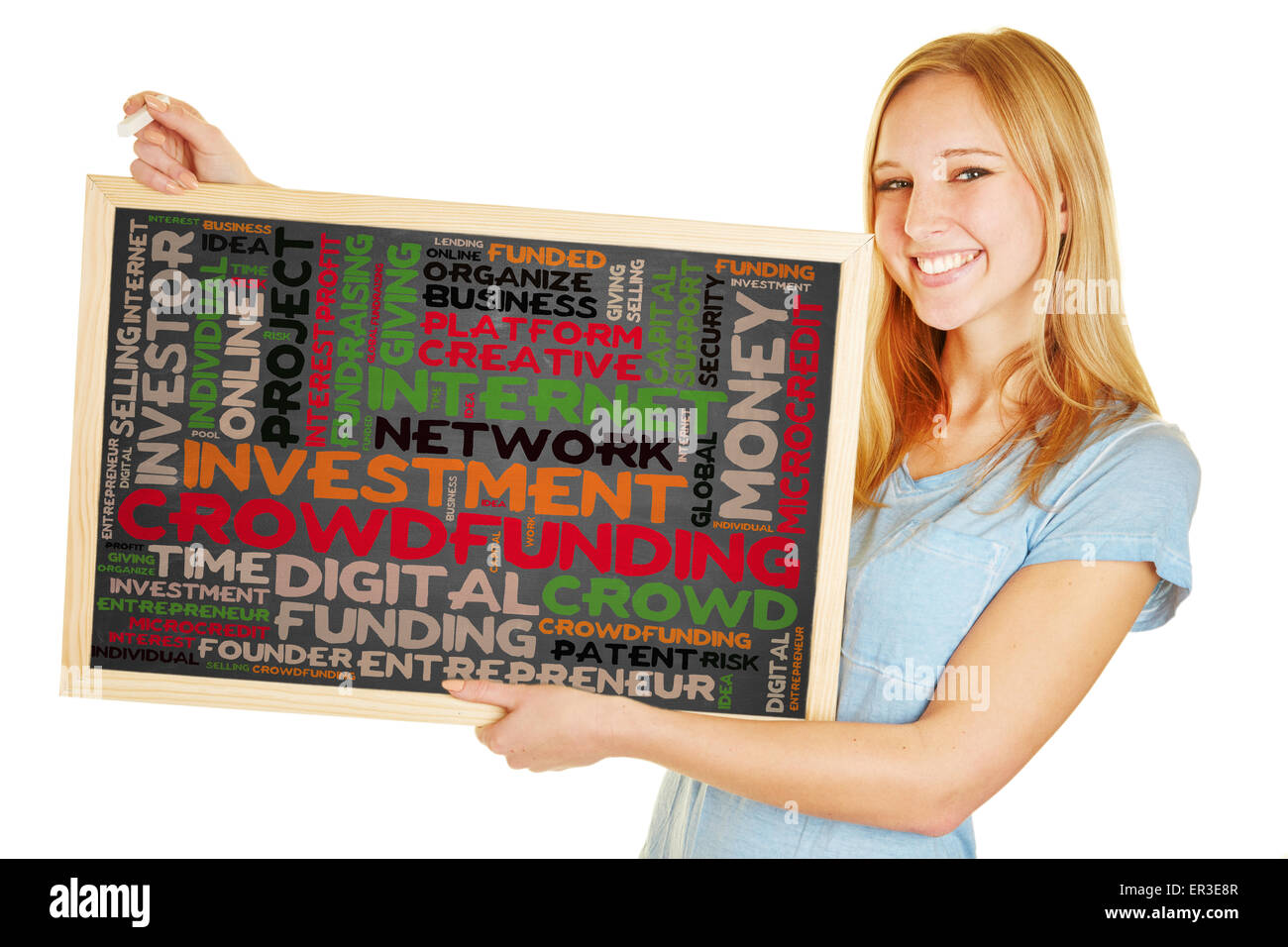 Young woman holding blackboard with crowdfunding concept as a tag cloud Stock Photo