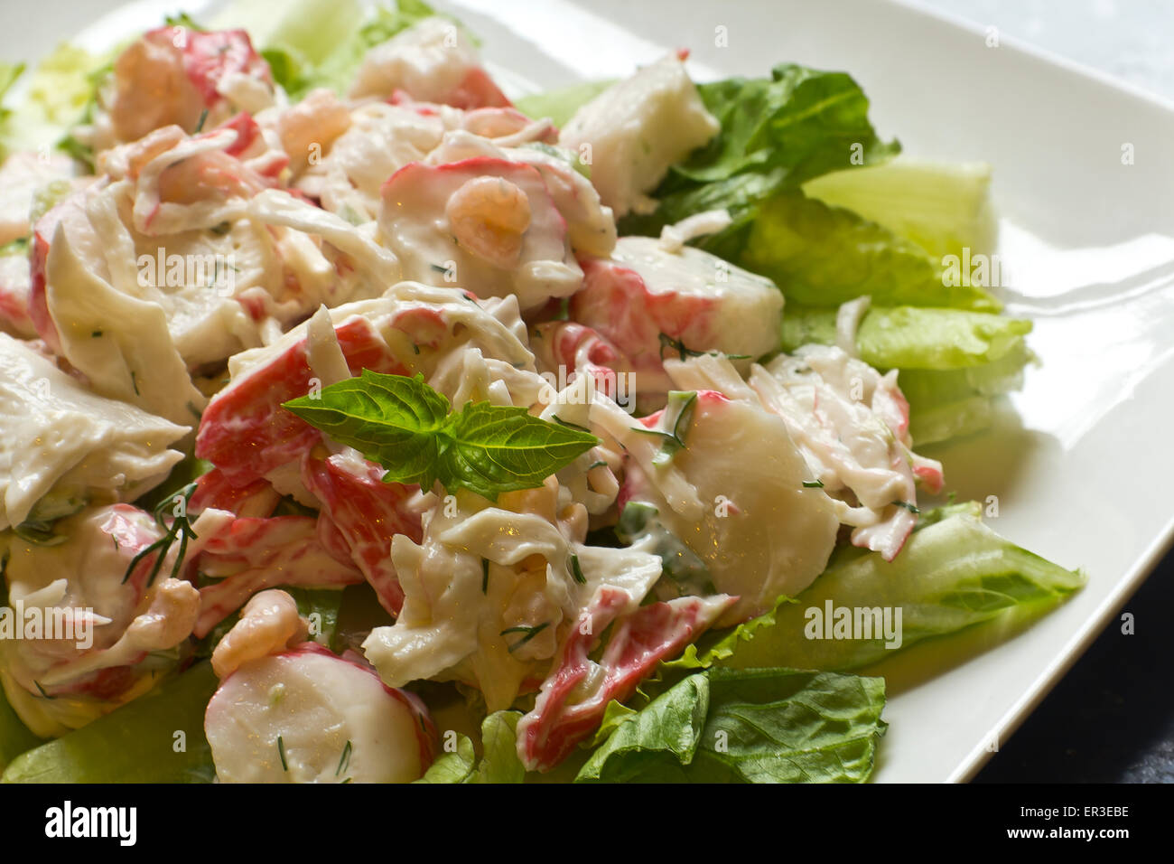 Mayonnaise seafood salad with shrimp and crab meat and fresh dill