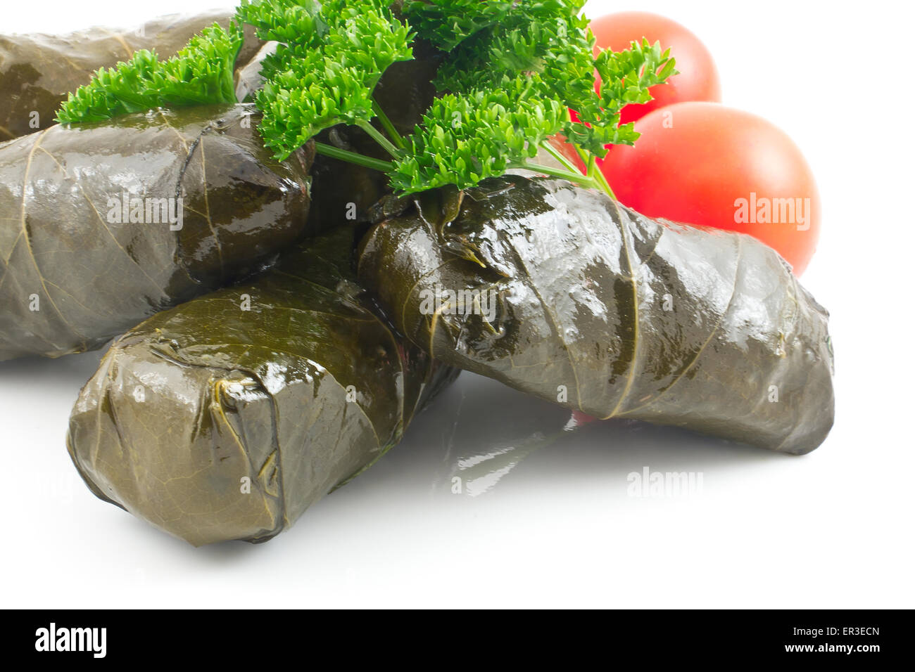 Armenian yaprak dolma, stuffed grape leaves garnished with fresh