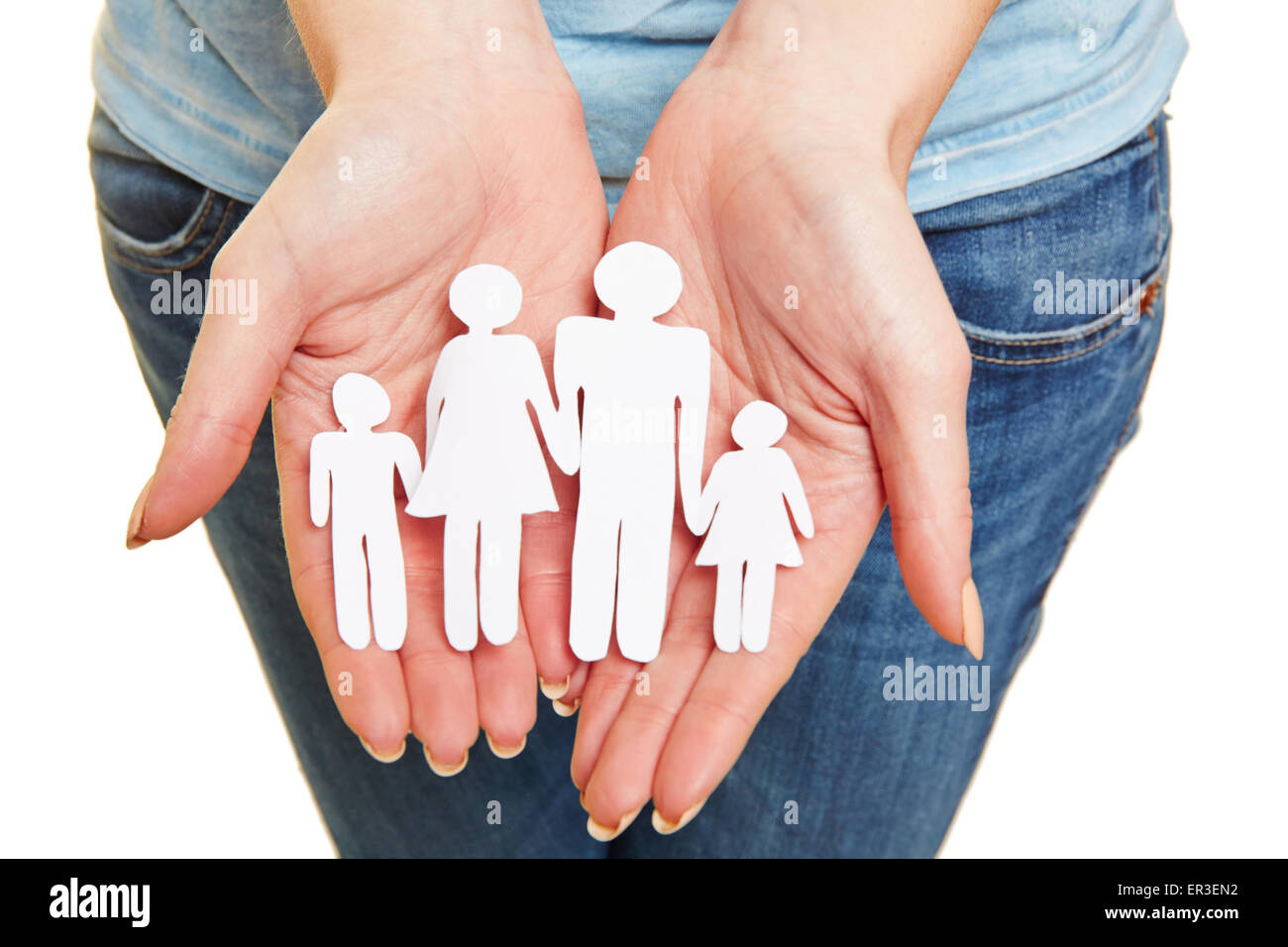 Hands holding paper family as symbol for family planning Stock Photo