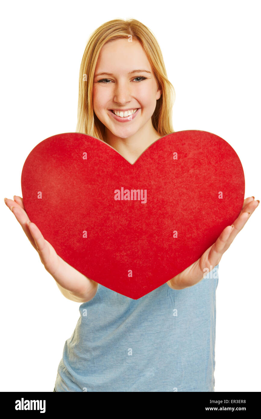 Young happy woman holding a big red heart as a love symbol Stock Photo ...