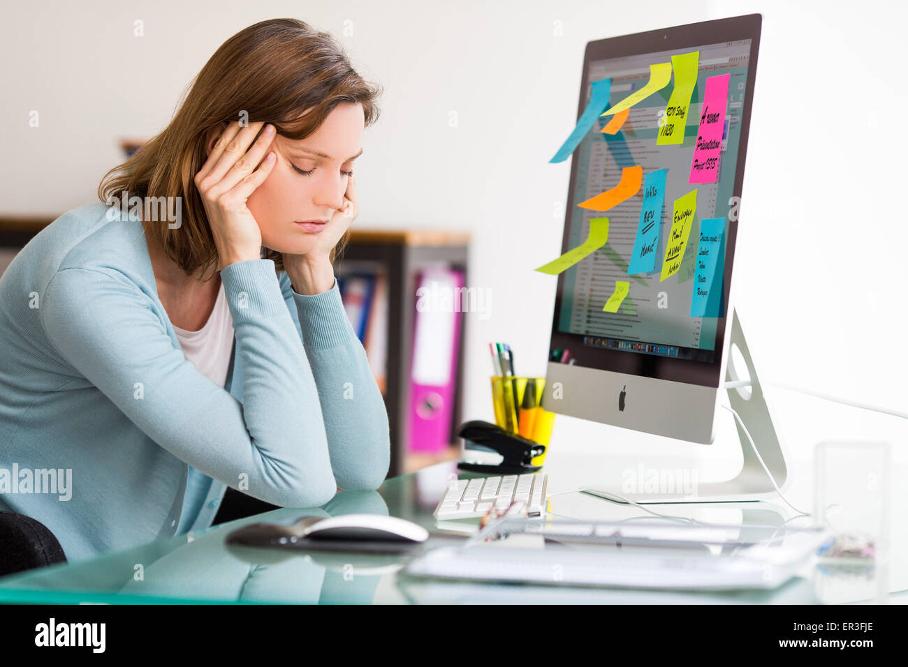 Stressed woman at work. Stock Photo